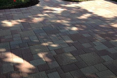 Inspiration for a mid-sized timeless backyard brick patio remodel in Houston