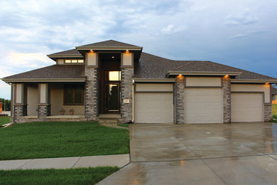 Modern beige one-story mixed siding exterior home idea in Omaha