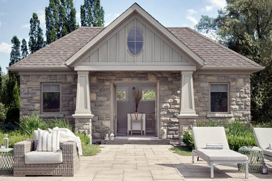 Example of a large transitional backyard stone and rectangular lap pool house design in Other