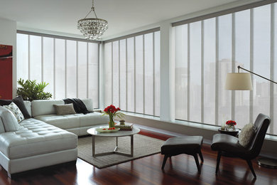 Example of a large minimalist formal and enclosed dark wood floor living room design in Providence with white walls, no fireplace and no tv
