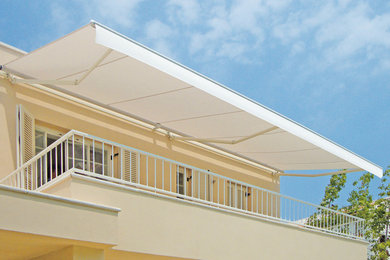 Photo of a contemporary patio in Sydney with an awning.