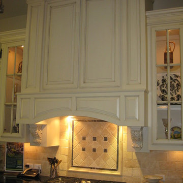 Wood range hood by Burrows Cabinets