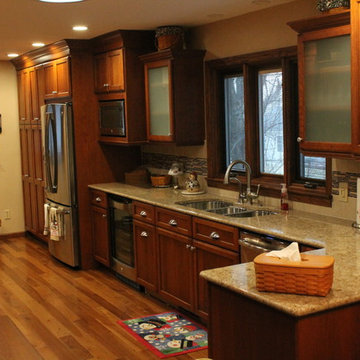 Omega Cabinetry, Ultima door, Cherry wood, Nutmeg stain.