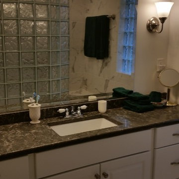 Granite countertop and mirror with glass block shower wall Murphy North Carolina