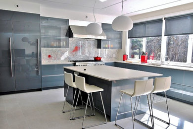 Contemporary l-shaped kitchen in Boston with an undermount sink, flat-panel cabinets, grey cabinets, multi-coloured splashback, with island, grey floor and white benchtop.