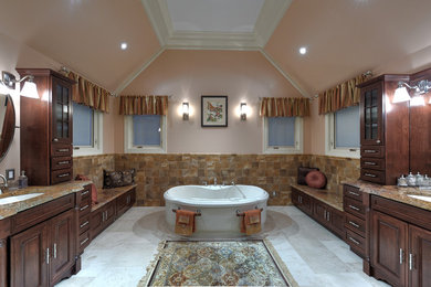 Bathroom - huge traditional master brown tile and stone tile porcelain tile bathroom idea in Philadelphia with an undermount sink, furniture-like cabinets, dark wood cabinets, granite countertops and brown walls