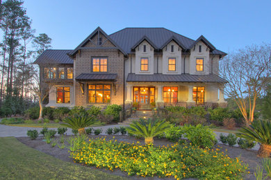 Inspiration for a huge timeless brown two-story mixed siding exterior home remodel in Atlanta