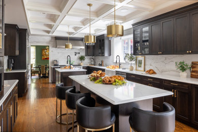 Eat-in kitchen - large transitional u-shaped light wood floor and coffered ceiling eat-in kitchen idea in Boston with a farmhouse sink, shaker cabinets, dark wood cabinets, quartz countertops, multicolored backsplash, ceramic backsplash, stainless steel appliances, two islands and white countertops