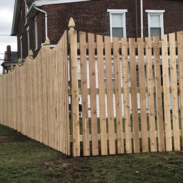 Western Red Cedar Spaced picket fence with French gothic posts and Concave Top