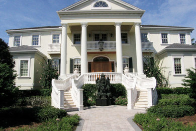 Large traditional two-story stucco exterior home idea in Tampa