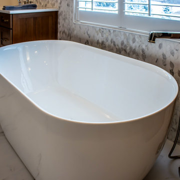 Luxury Spa Bathroom with Natural Warm Vanities, Quartz Countertop, Tiled Shower
