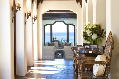 Hallway - mid-sized mediterranean dark wood floor hallway idea in San Diego