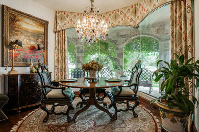 Enclosed dining room - mid-sized traditional medium tone wood floor and brown floor enclosed dining room idea in Dallas with white walls and no fireplace