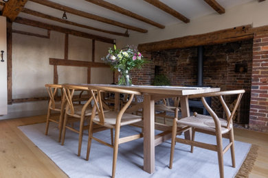 Medium sized modern dining room in Sussex.