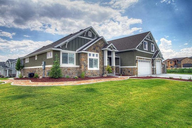 Large craftsman green three-story mixed siding gable roof idea in Salt Lake City