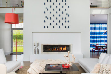 Living room - large contemporary formal living room idea in New York with white walls and a ribbon fireplace
