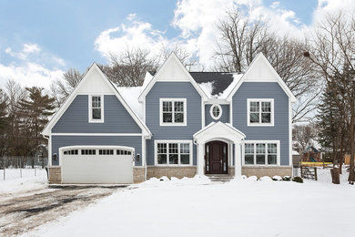 Large transitional multicolored two-story mixed siding exterior home photo in Chicago with a shingle roof