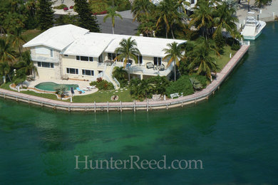 Example of a beach style home design design in Miami