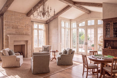 Sunroom - mid-sized rustic medium tone wood floor and brown floor sunroom idea in Miami with a standard fireplace, a stone fireplace and a standard ceiling
