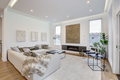Trendy formal and open concept beige floor and wall paneling living room photo in DC Metro with a metal fireplace and a concealed tv