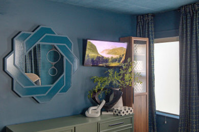 Bedroom - small modern guest light wood floor, brown floor, wallpaper ceiling and wood wall bedroom idea in New York with blue walls