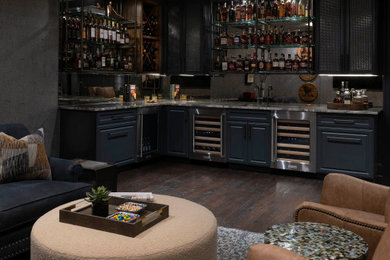 Transitional l-shaped dark wood floor and brown floor wet bar photo in Dallas with blue cabinets and mirror backsplash