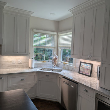 White inset cabinetry with walnut custom accents