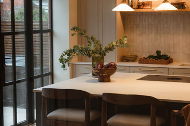 Inspiration for a medium sized victorian l-shaped open plan kitchen in Other with shaker cabinets, quartz worktops, beige splashback, porcelain splashback, an island and white worktops.