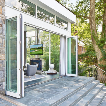 Glass encased Media Room opens to back patio