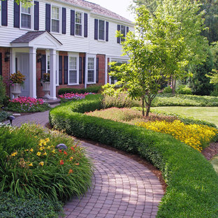 Inspiration for a traditional front yard garden in Chicago with brick pavers and with flowerbed.