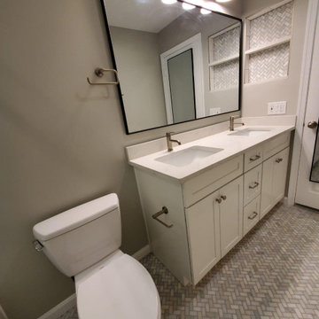 Bathroom remodeled With Double Sink, Standing Shower, Door Mirror & Flushing Toi
