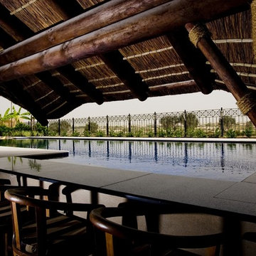 Thatch & timber is the is the focal point of this beautifully landscaped garden