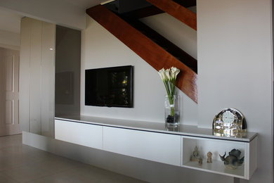 Photo of a mid-sized contemporary open concept living room in Brisbane with ceramic floors, no fireplace and a built-in media wall.