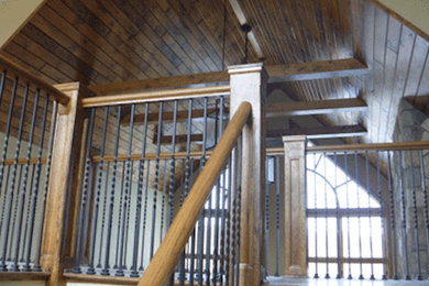 Mid-sized elegant wooden l-shaped staircase photo in New York with metal risers