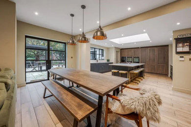 This is an example of a midcentury dining room in Other.