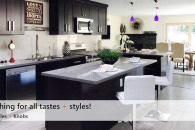 Kitchen - contemporary porcelain tile and white floor kitchen idea in Toronto with an undermount sink, shaker cabinets, black cabinets, quartzite countertops, white backsplash, stainless steel appliances and beige countertops