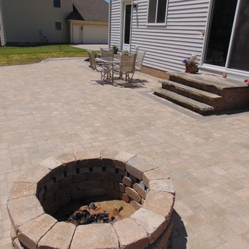 Patio with Natural Stone Steps, Seating Wall, and low voltage lighting