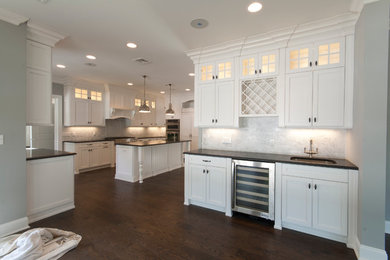 Example of a transitional u-shaped eat-in kitchen design in New York with an undermount sink