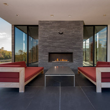 Walker Road Great Falls, Virginia modern home outdoor covered terrace with firep