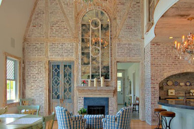 Family room - large country open concept family room idea in Providence with multicolored walls, a stone fireplace and no tv