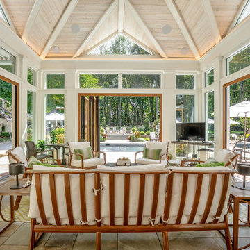 Inside the cabana: vaulted wood ceiling and NanaWall glass open on all sides to 