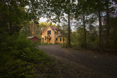 Country two-story vinyl gable roof idea in Boston
