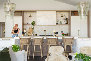 Photo of a large traditional kitchen in Berkshire with shaker cabinets, white cabinets and an island.