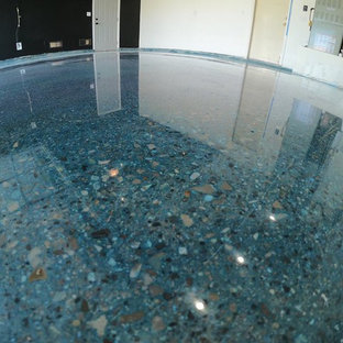 Photo of a modern home studio in Las Vegas with concrete flooring and blue floors.