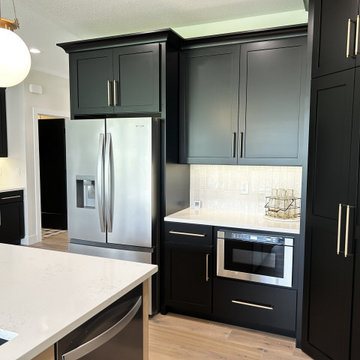 Black and Maple Wheat Kitchen with Brass Banded Hood