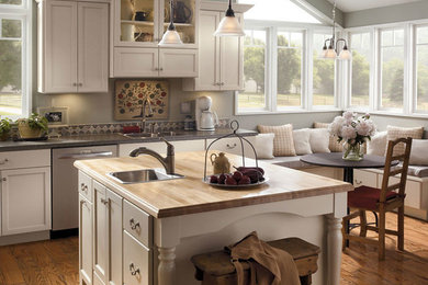 Example of a mid-sized transitional medium tone wood floor and brown floor eat-in kitchen design in Cedar Rapids with a double-bowl sink, shaker cabinets, white cabinets, stainless steel appliances and an island