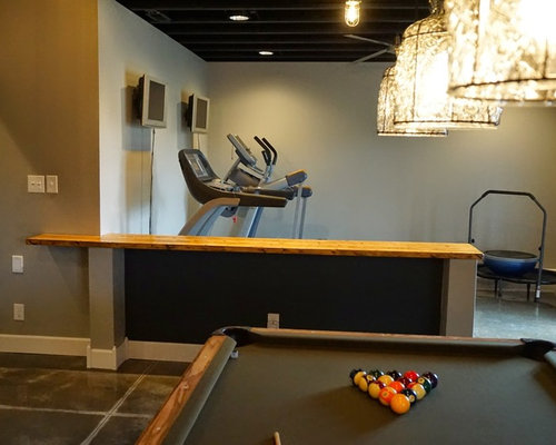 Inspiration for a small modern multiuse home gym remodel in Louisville with gray walls and concrete Modern Home Gym Louisville Modern Home Gym Louisville Inspiration for a small modern multiuse home gym remodel in Louisville with gray walls and concrete