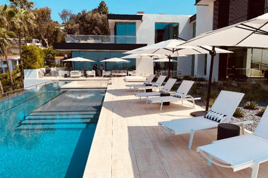 Trendy pool photo in Los Angeles