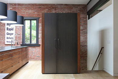 Design ideas for a modern kitchen in San Francisco with shaker cabinets, medium wood cabinets and panelled appliances.