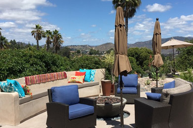 Example of a mid-sized trendy backyard concrete patio design in San Diego with a fire pit and no cover